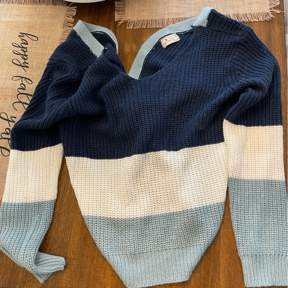 Blue and white sweater. Twist on back